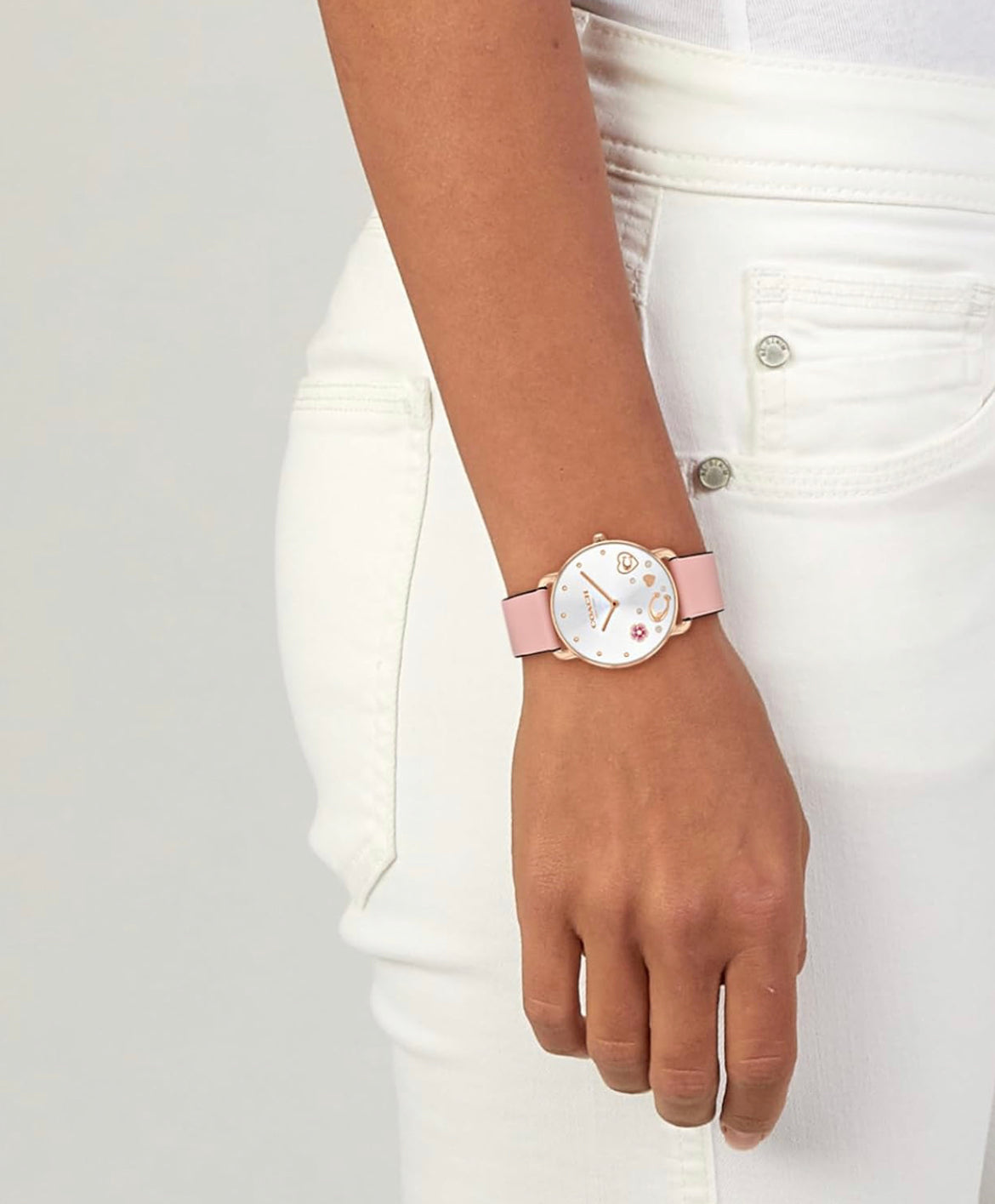 Coach Rose Gold Tone Watch With Fashionable Charms in The Dial and a Light Pink Leather Strap